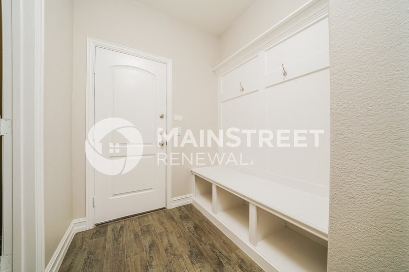 two closets in a small room with a door