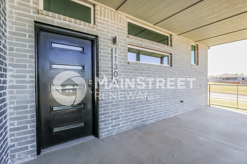 a door on the side of a building with a glass window