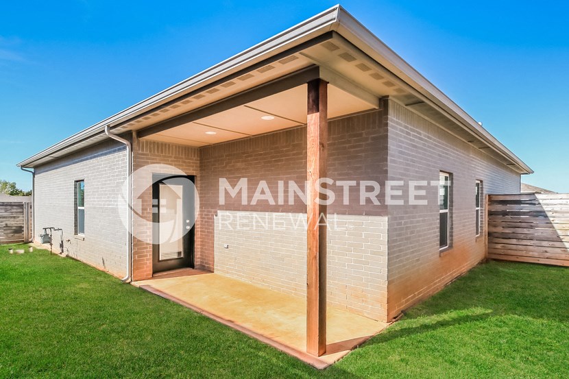 exterior of a small house with a lawn