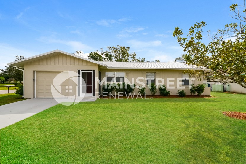 a house with a lawn in front of it