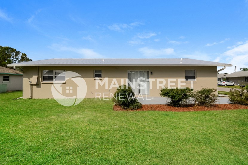 a home with a lawn in front of it