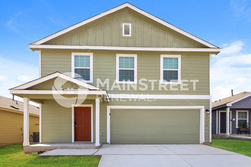 front view of a house with a garage door