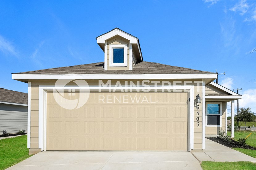 a garage door with a window on top of a house