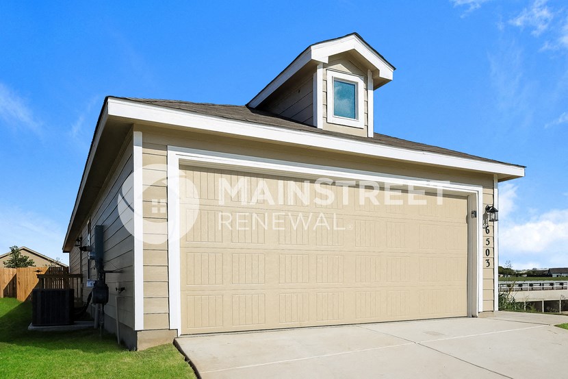 a garage door with the words main street renewal on it