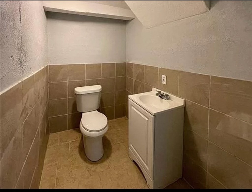a small bathroom with a toilet and a sink