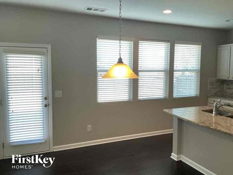 A kitchen with a FirstKey Homes logo.