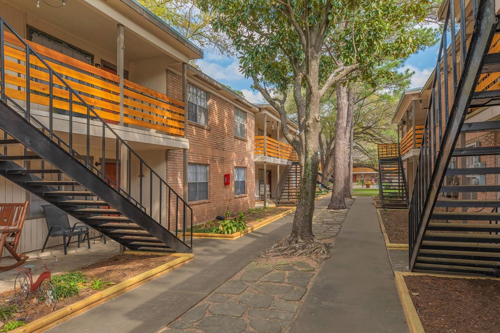 our apartments have a spacious courtyard with trees and stairs