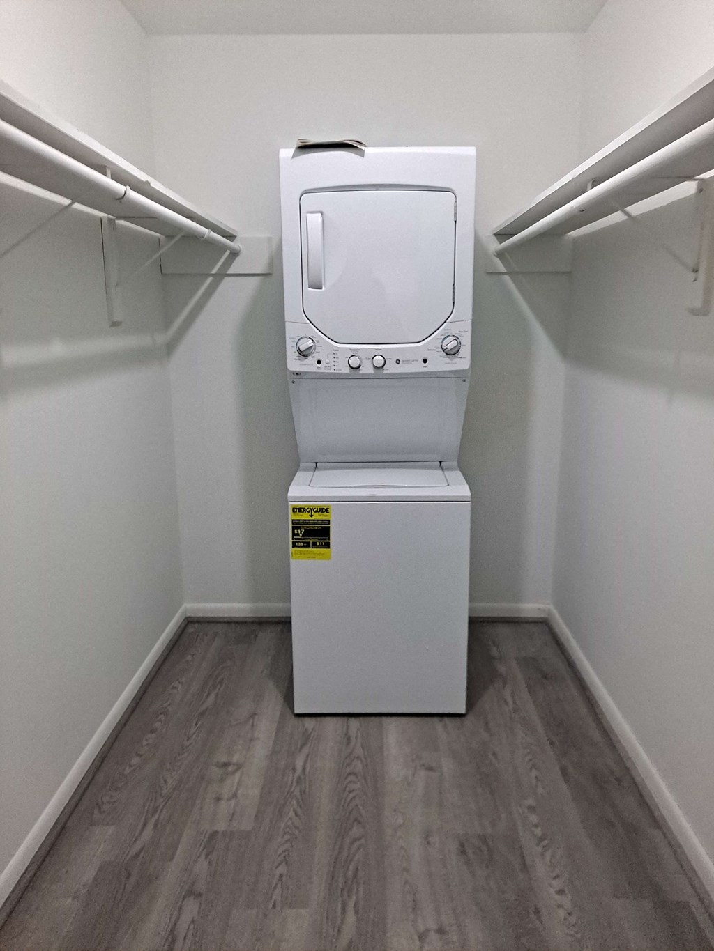 a washer and dryer in a room with a closet
