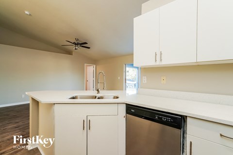 A kitchen with a dishwasher and a sink.