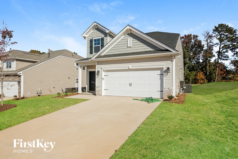 A house with a garage is shown in the image.