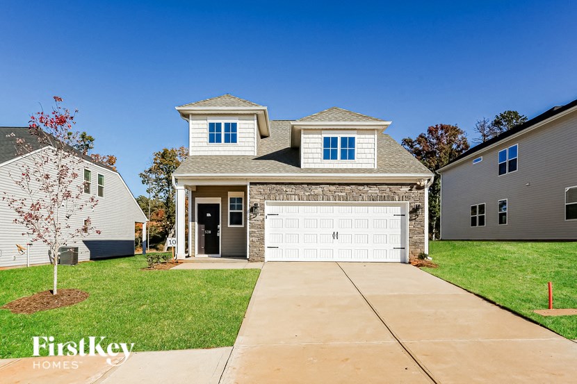 a suburban house with a white garage door