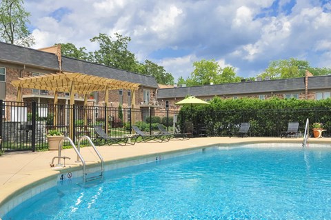 A swimming pool with a blue tinted water and a white number 4 on the side.