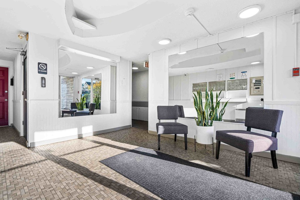 a lobby with chairs and a table