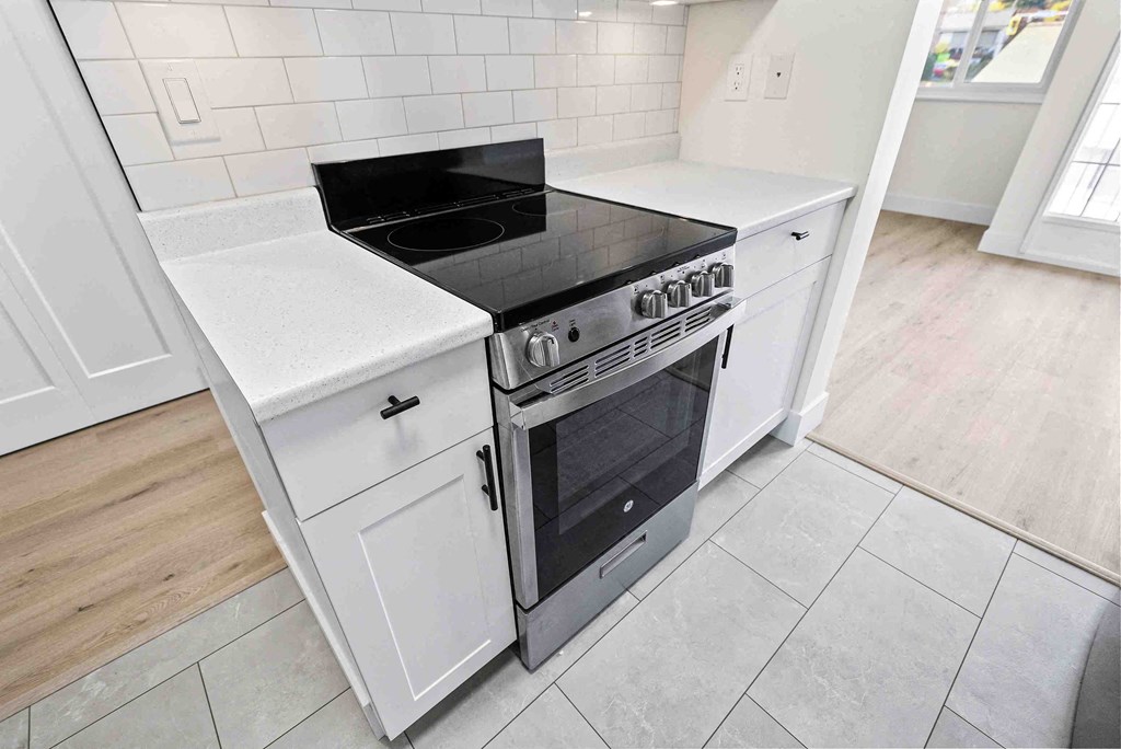 a kitchen with a stove and a counter top