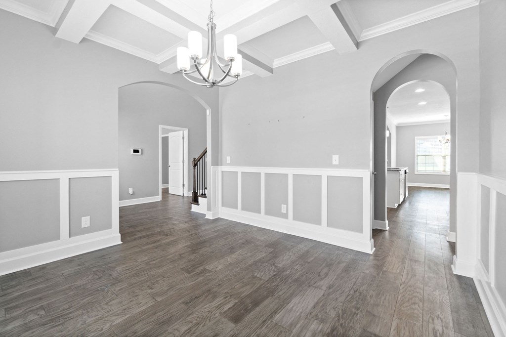 the living room and entryway of a new home