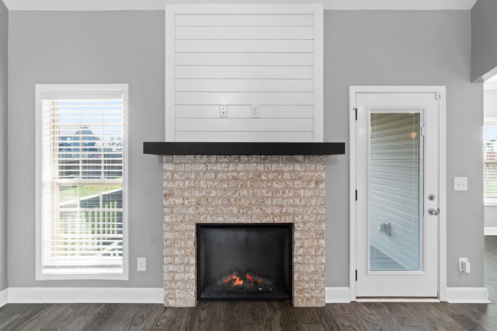 the fireplace in the living room of a new home