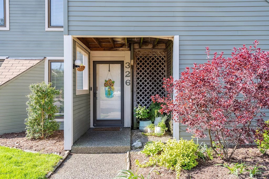 A house number 326 with a door and a window.
