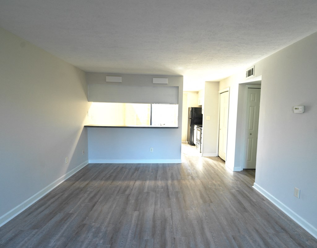 A room with a window and a door.