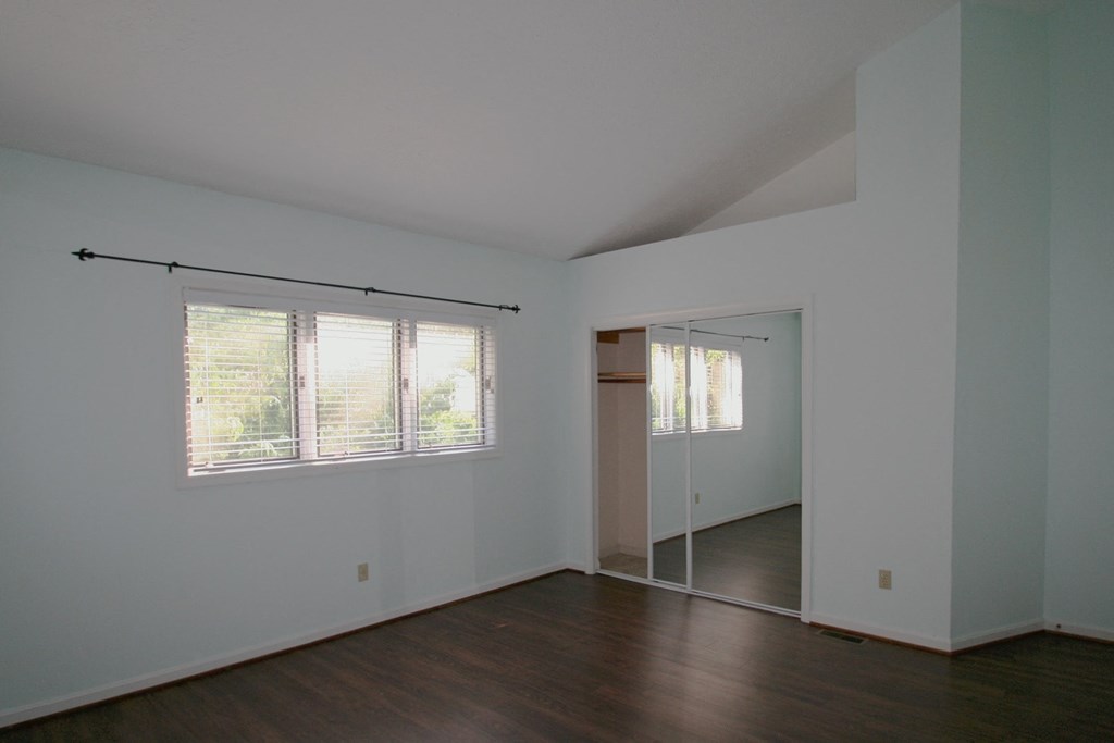 A room with a sliding door and a window.