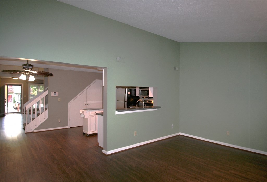 A room with a staircase and a window.