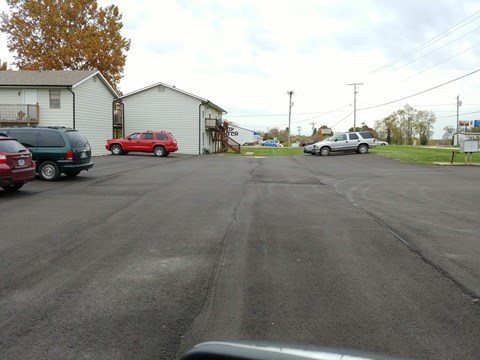 a city street with cars parked on the side of it