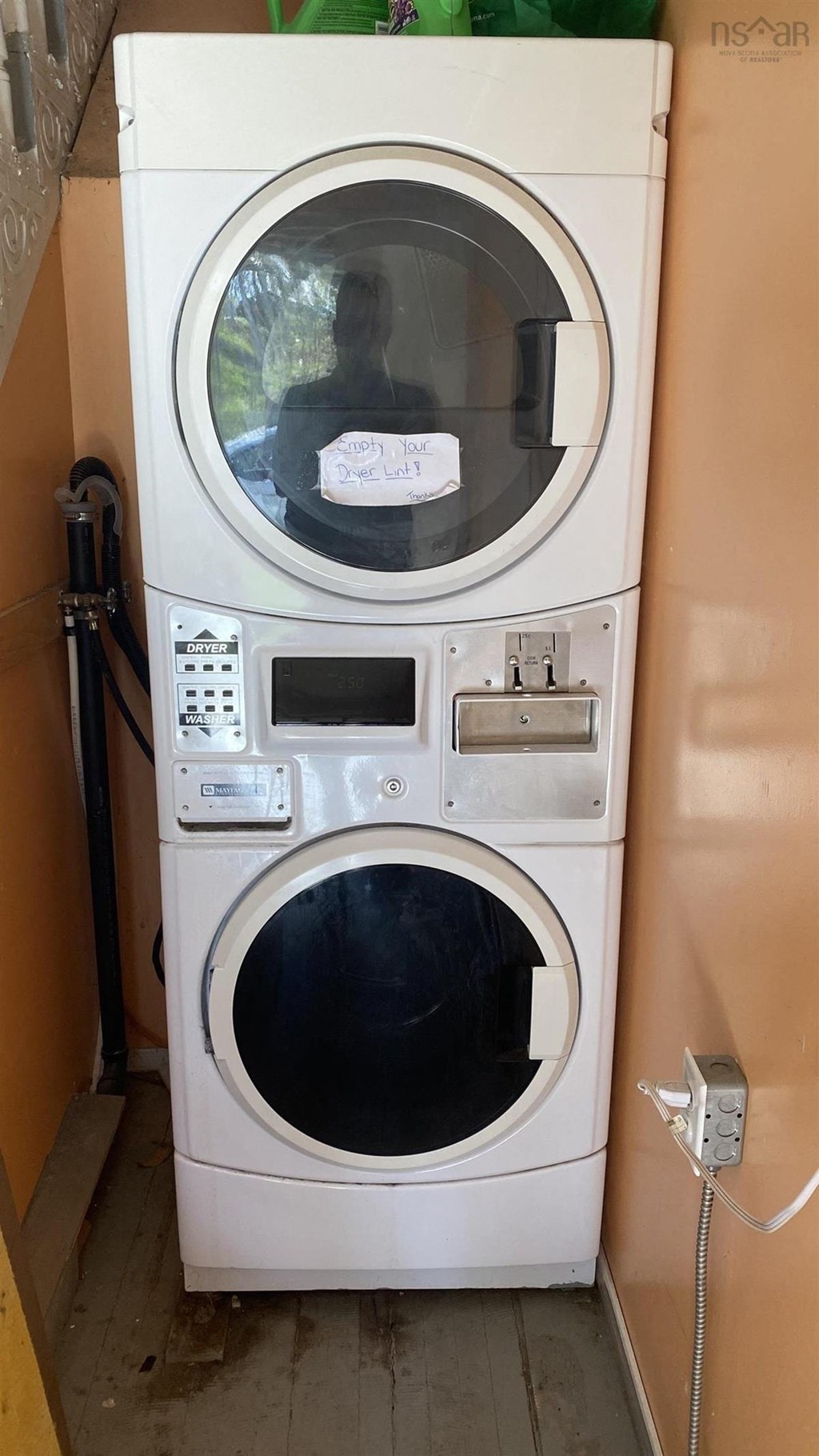 a washing machine and dryer stacked on top of each other