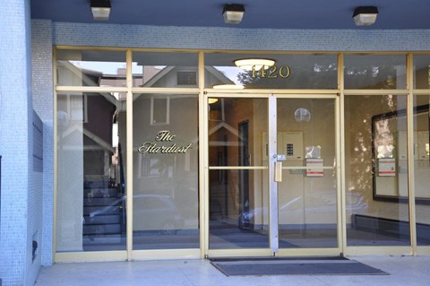 The Hardest store front with a glass door and a sign above it.
