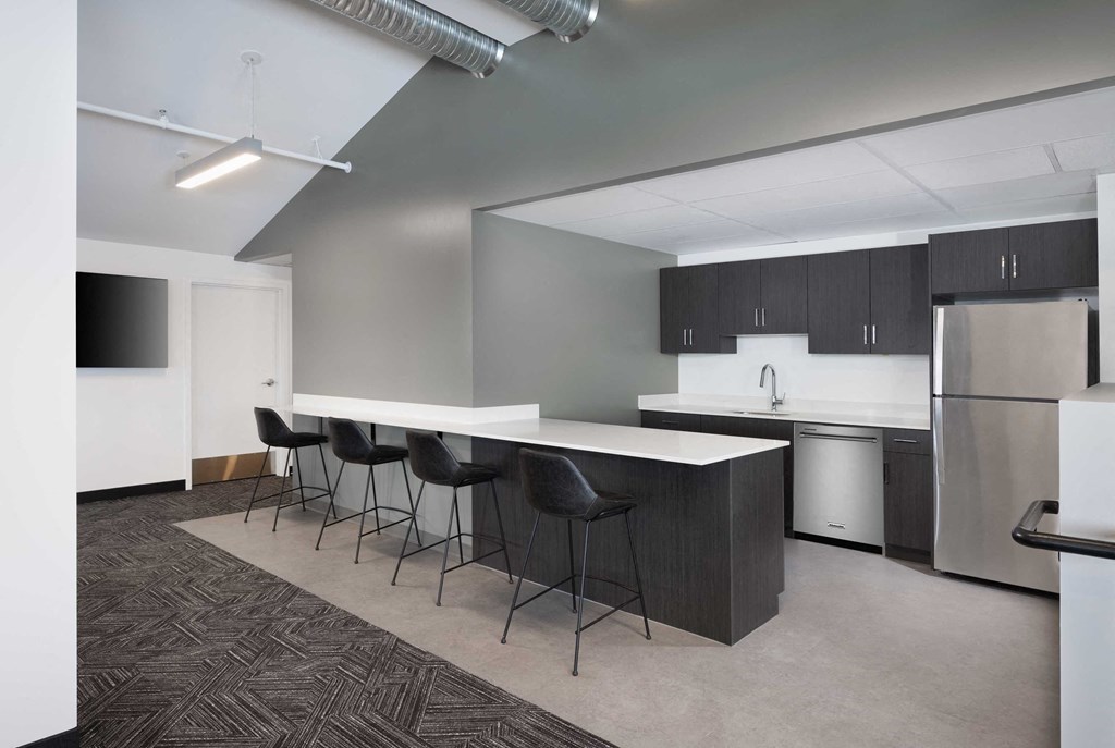 a kitchen and dining area in an empty room