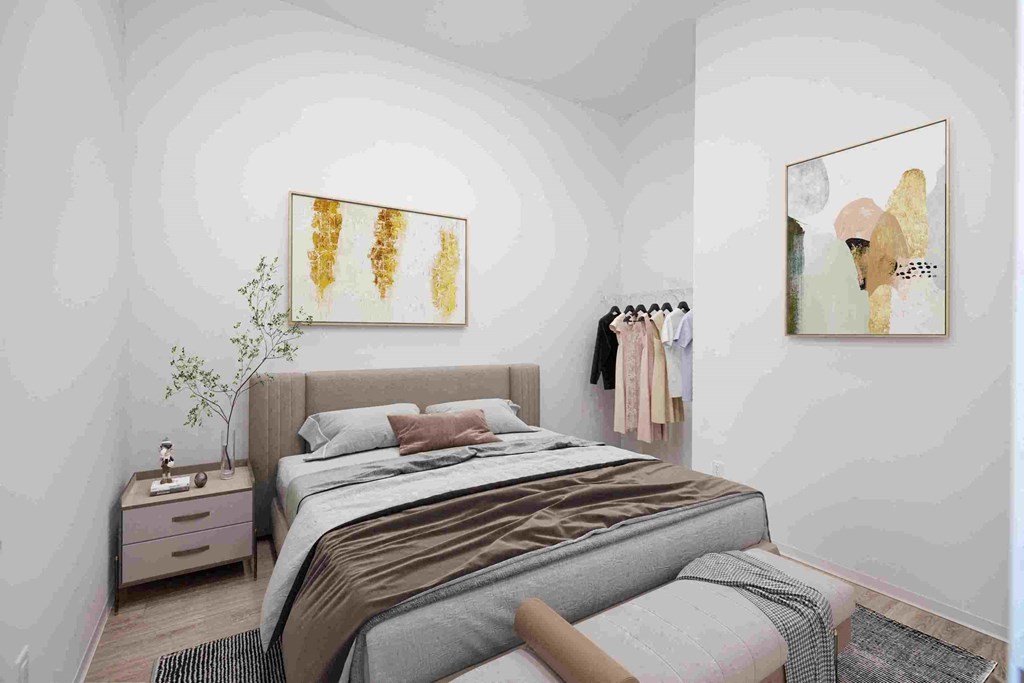 a bedroom with a bed and a dresser