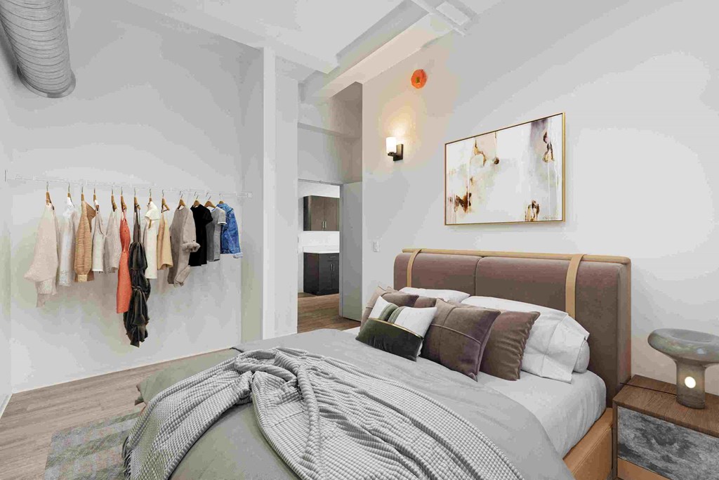 a bedroom with a bed and a closet