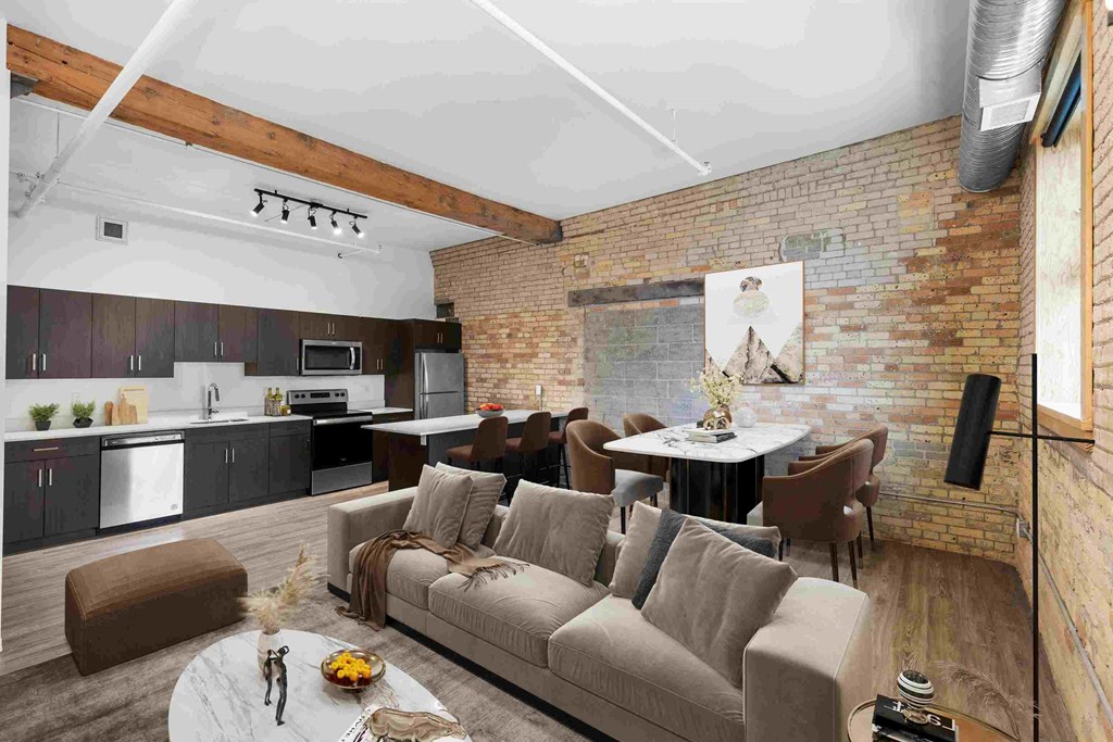 a large living room with a large couch and a table