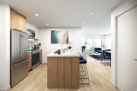 A modern kitchen with a wooden island and stainless steel appliances.