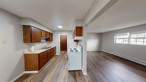 our apartments offer a kitchen with a stove and a sink