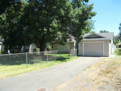 a house with a driveway and a garage door