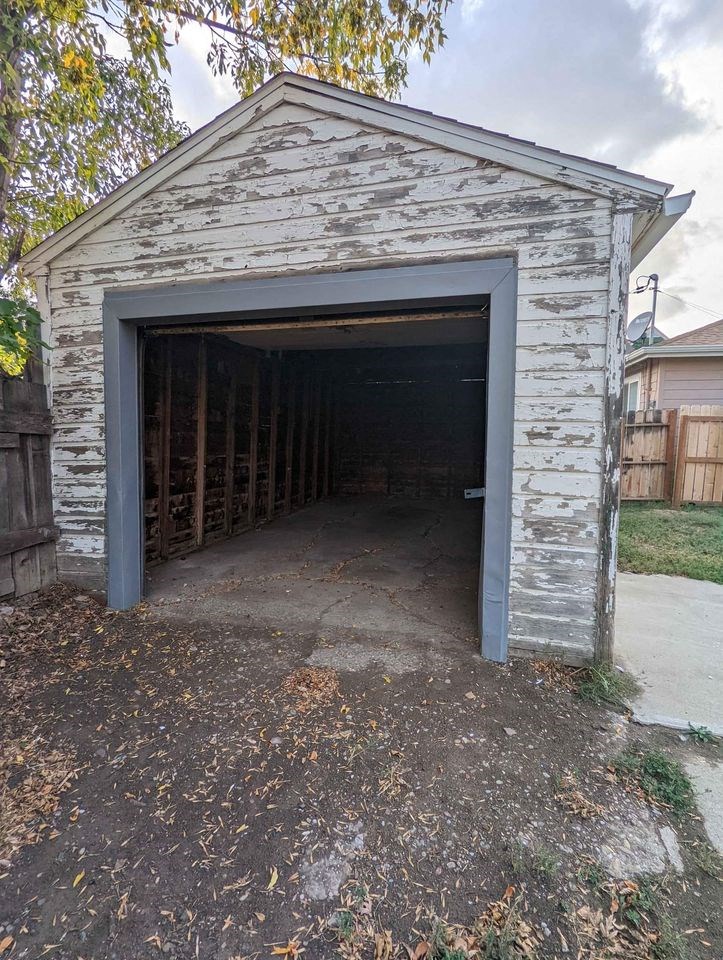 an empty garage with its door open