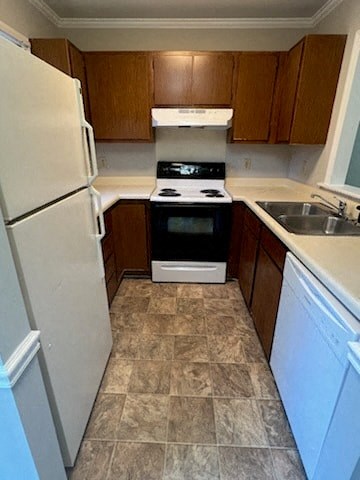 a kitchen with a stove refrigerator and a sink