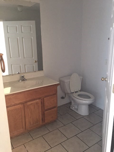 a bathroom with a toilet and a sink