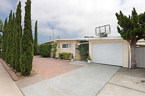 a house with a garage door and a driveway