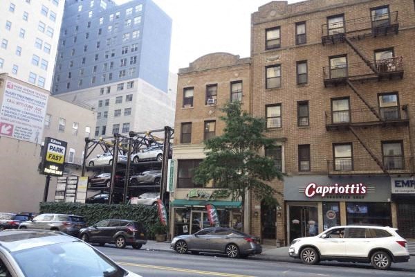 A Capriotti's restaurant is located on the corner of a street.