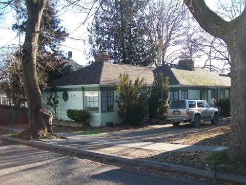a house with a truck parked in front of it