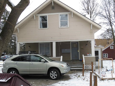 a car parked in front of a house