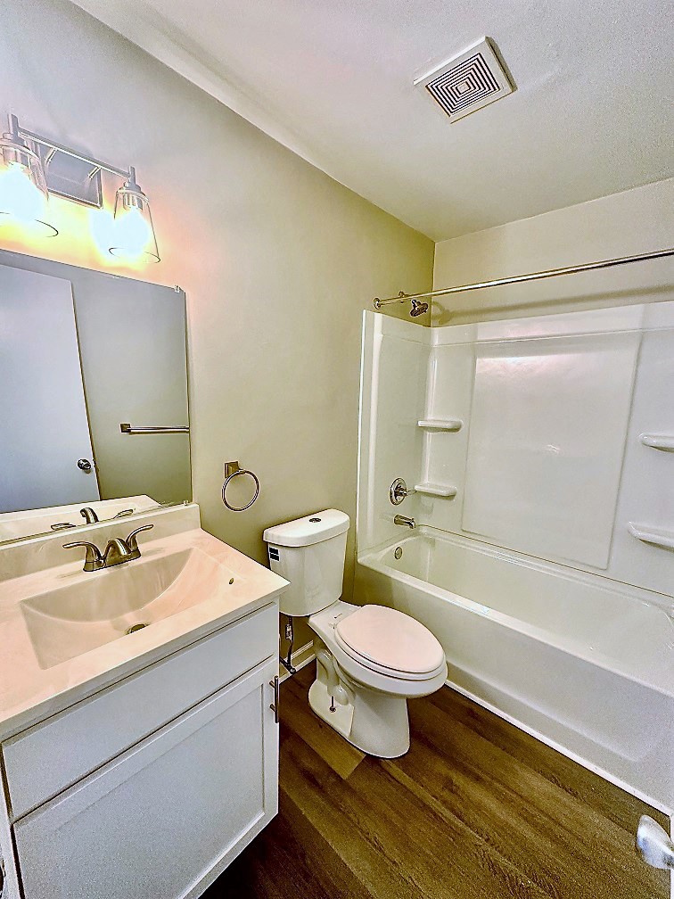 a bathroom with a sink toilet and a bath tub