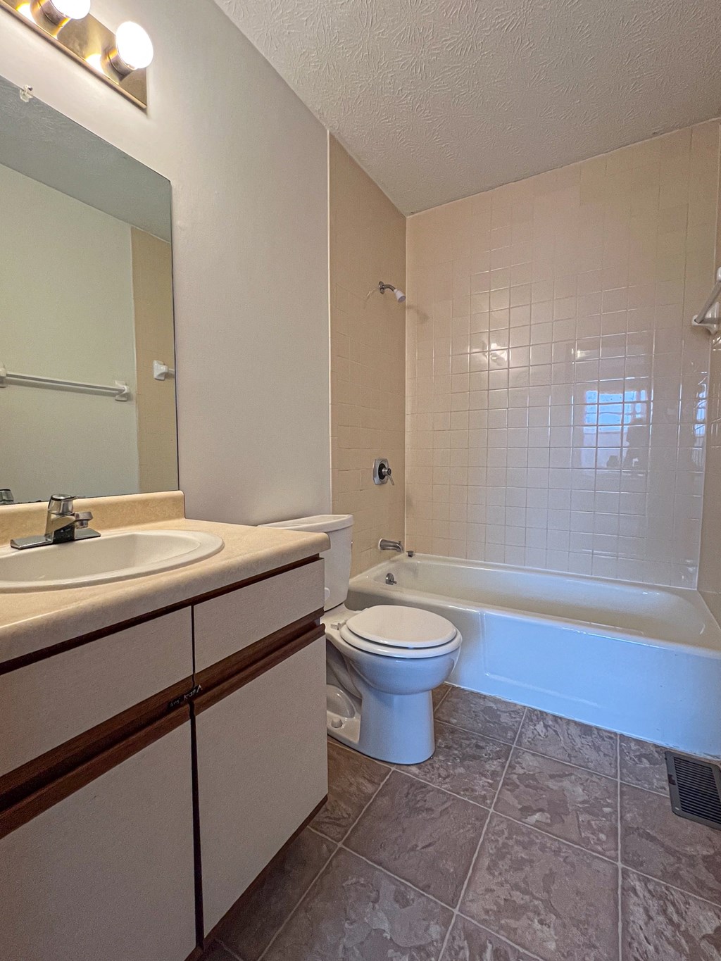 a bathroom with a sink toilet and a bath tub