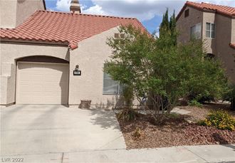a house with a driveway and a garage door