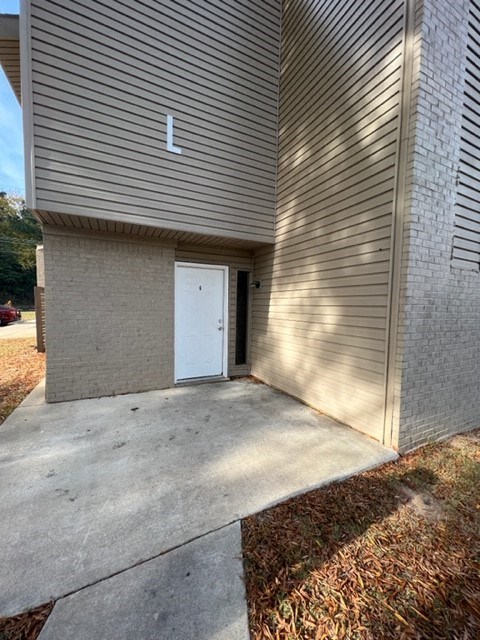 a white door on the side of a building