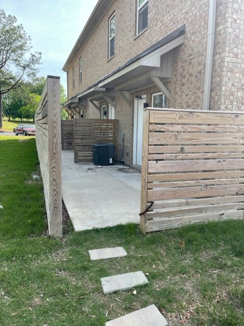 a wooden fence in front of a house