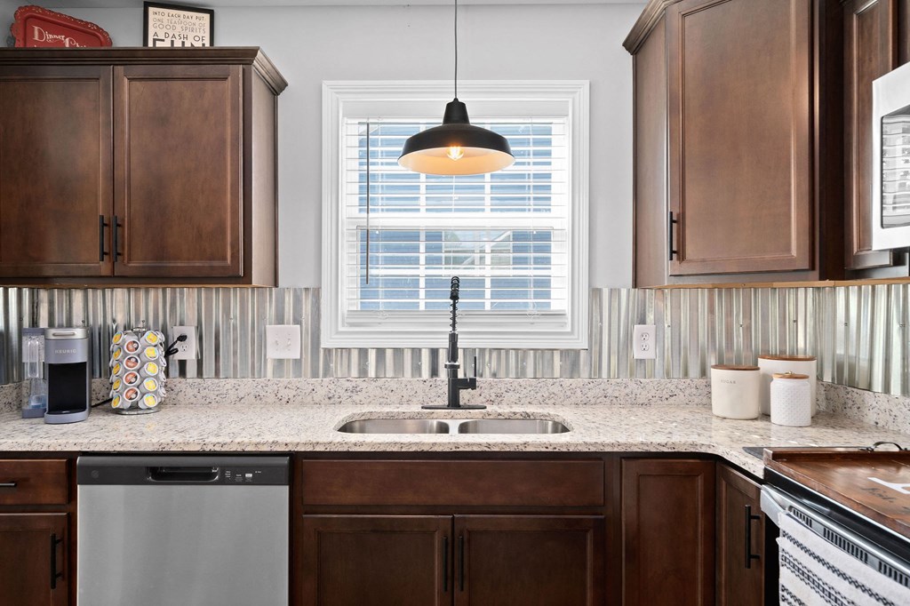 a kitchen with a sink and a window