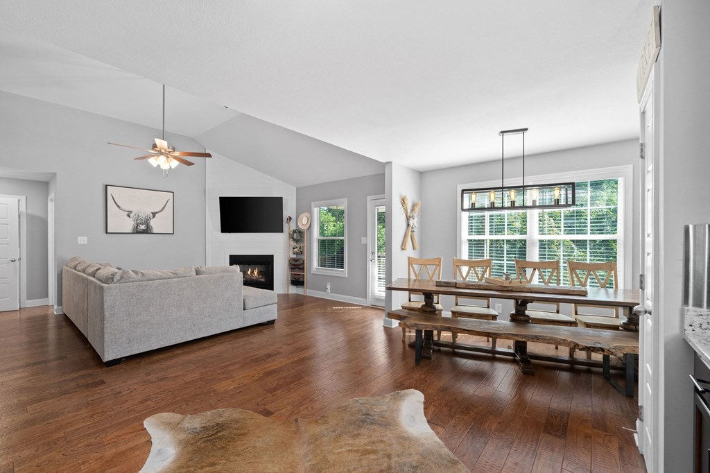 a living room with a couch and a table and a fireplace