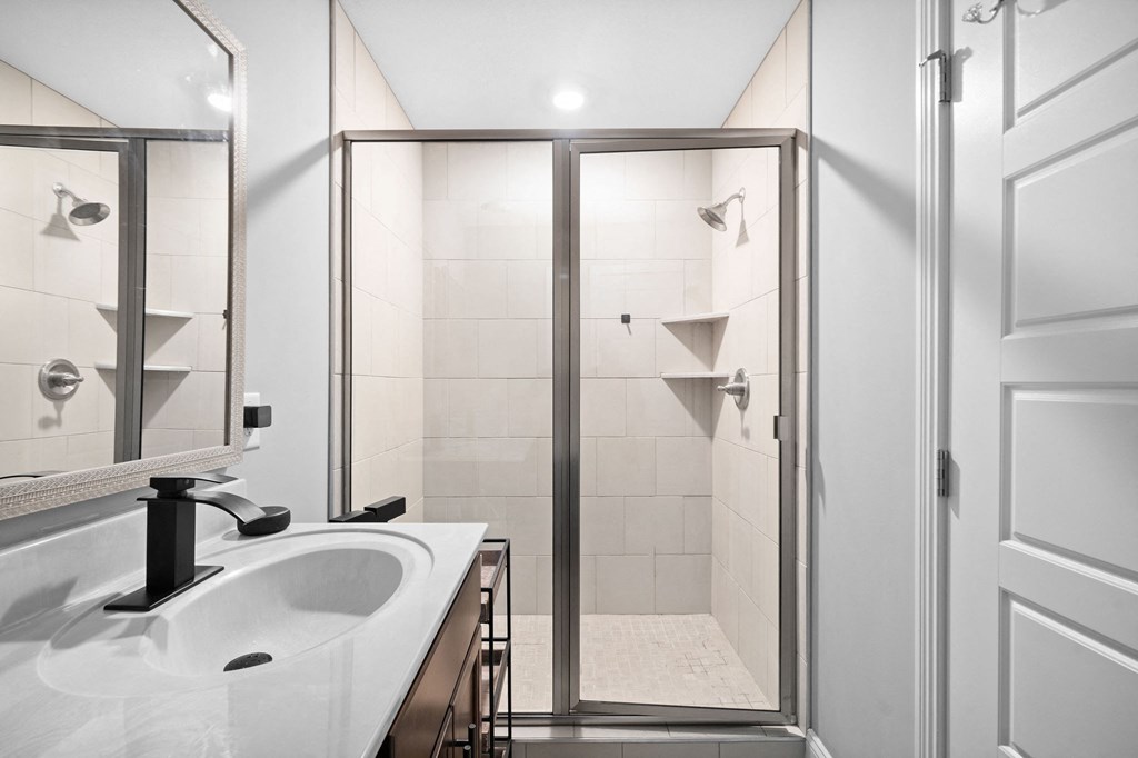 a bathroom with a sink and a shower