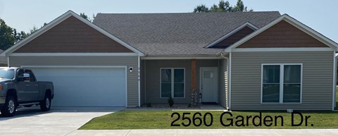 a home with a truck parked in the driveway